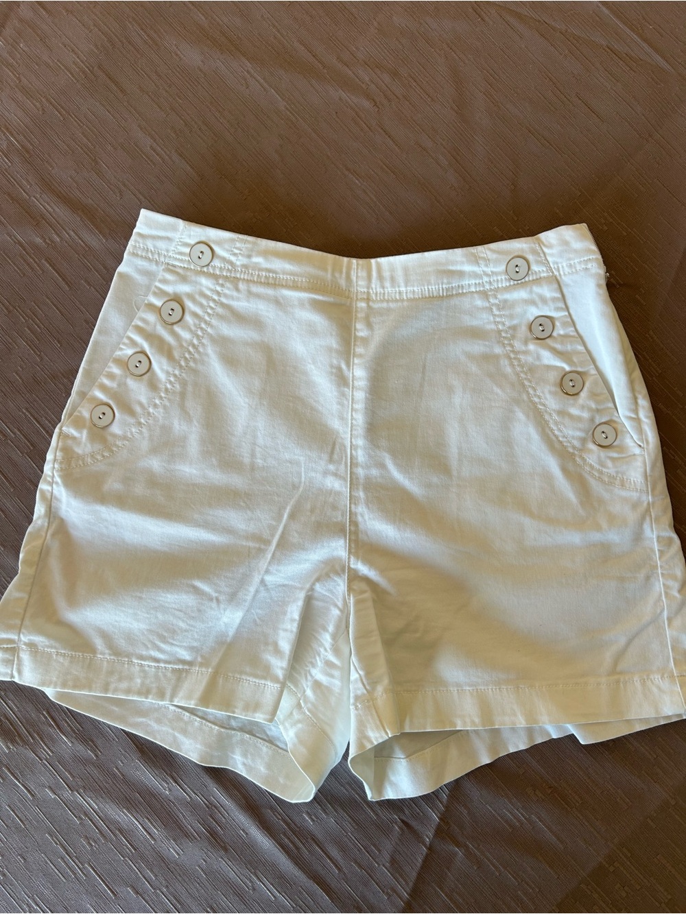 White shorts, front and back pockets, inseam 3 1/2”, waist 28”, size 6